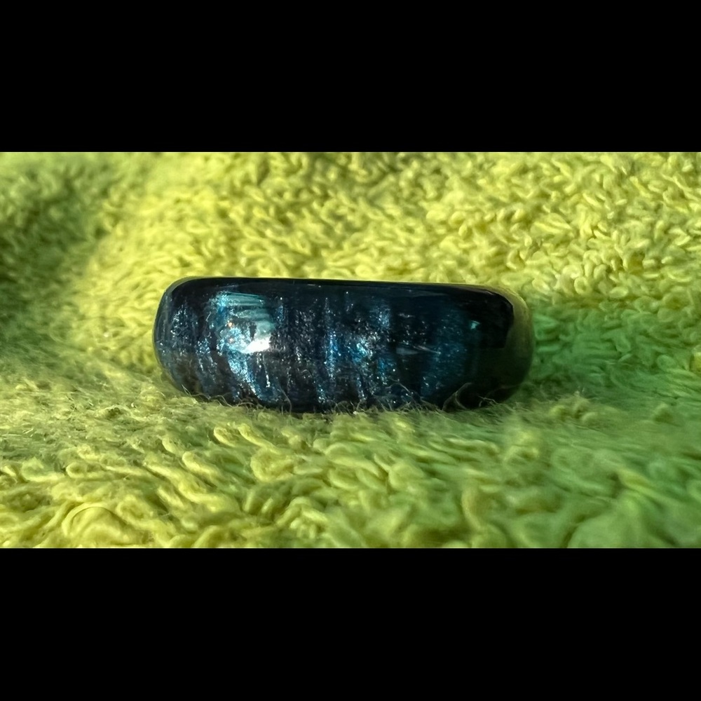 Fire opal ring, lab created, carbon fiber lining. Size 10.25